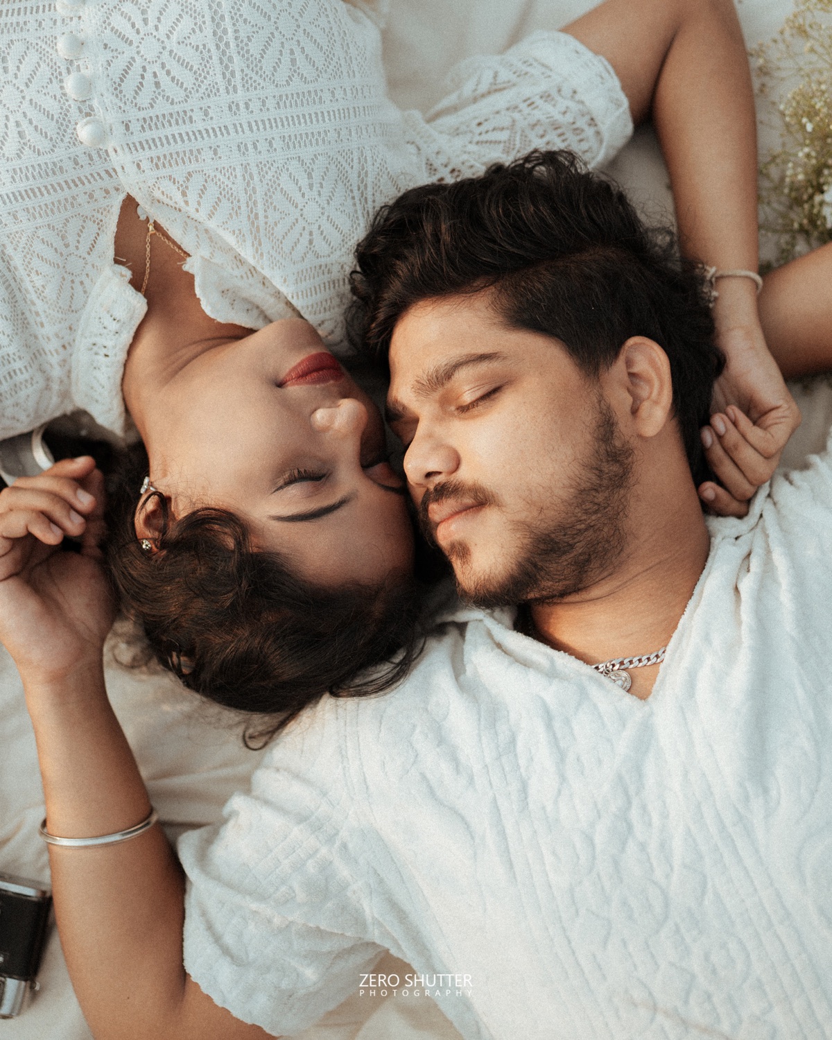 Couple lying together, photographed from above