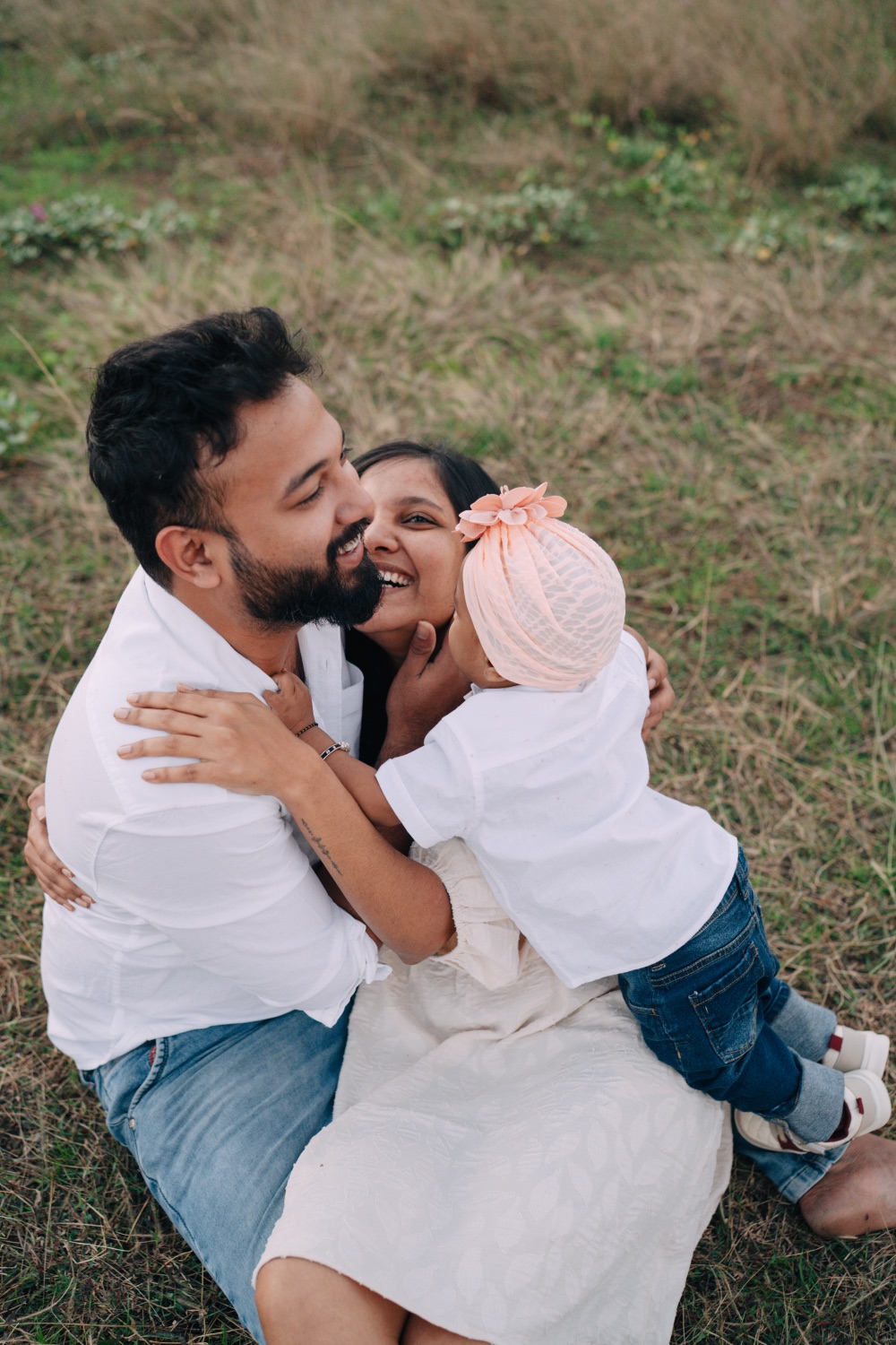 Parents sharing a tender moment with their baby