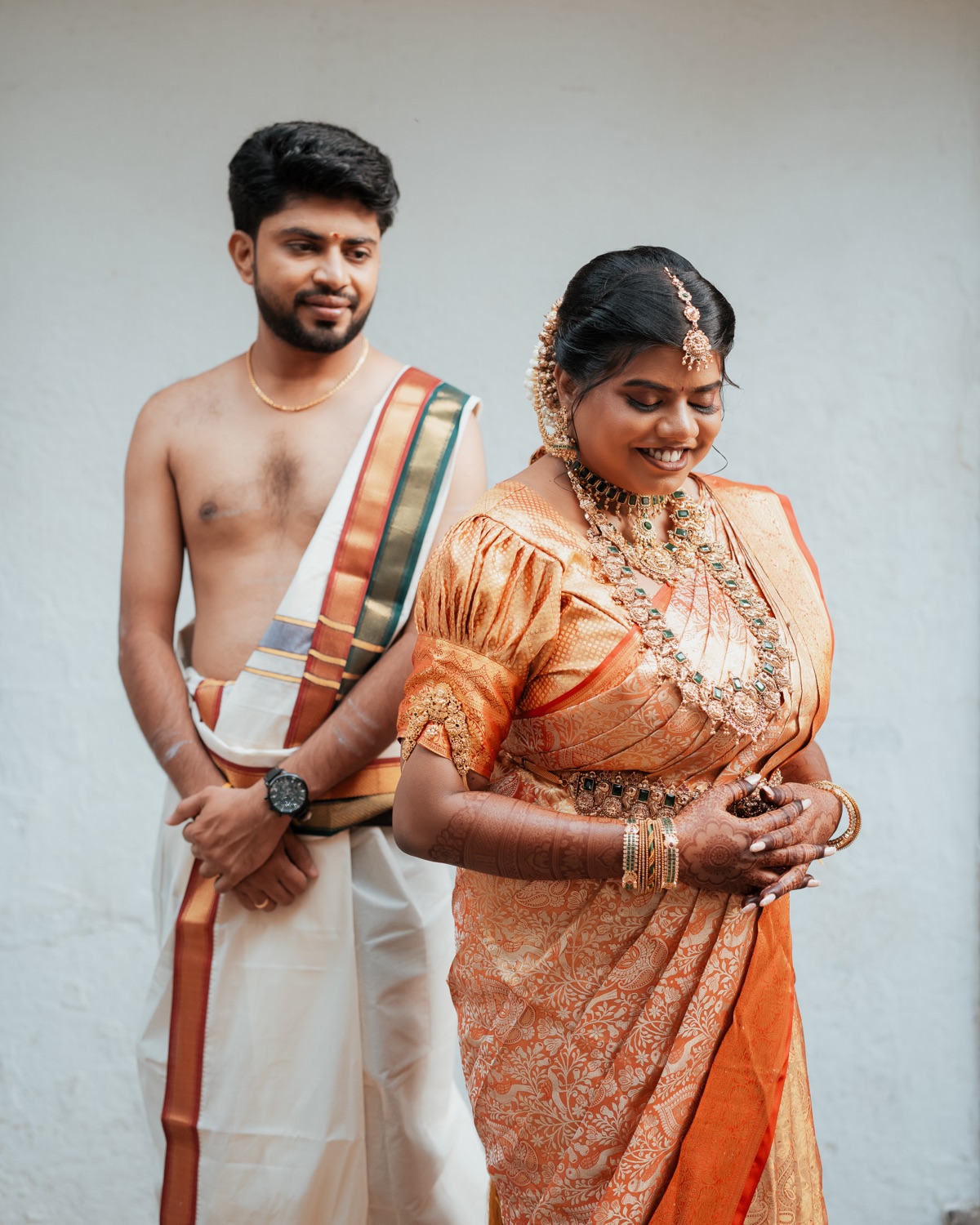 Bride and groom in traditional South Indian wedding attire